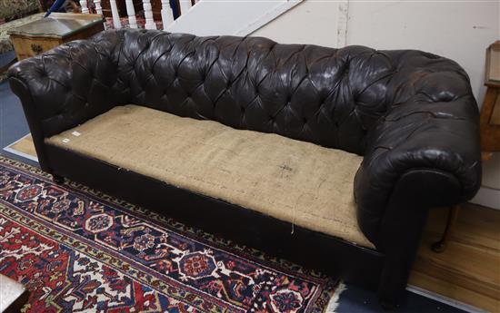 An early 20th century buttoned brown leather chesterfield settee L.194cm
